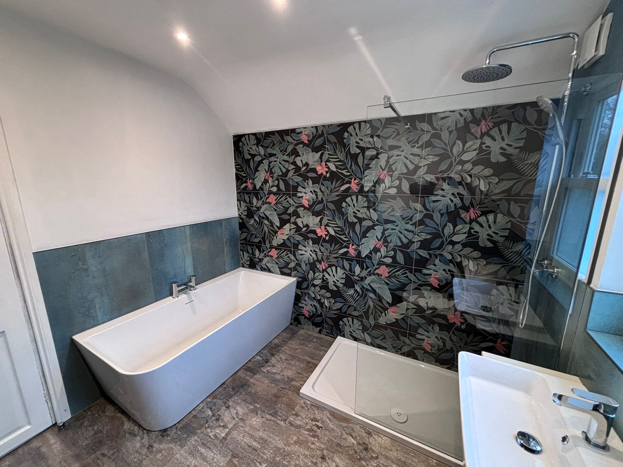 Freestanding bath and walk-in shower in a loft en-suite by Goldswan