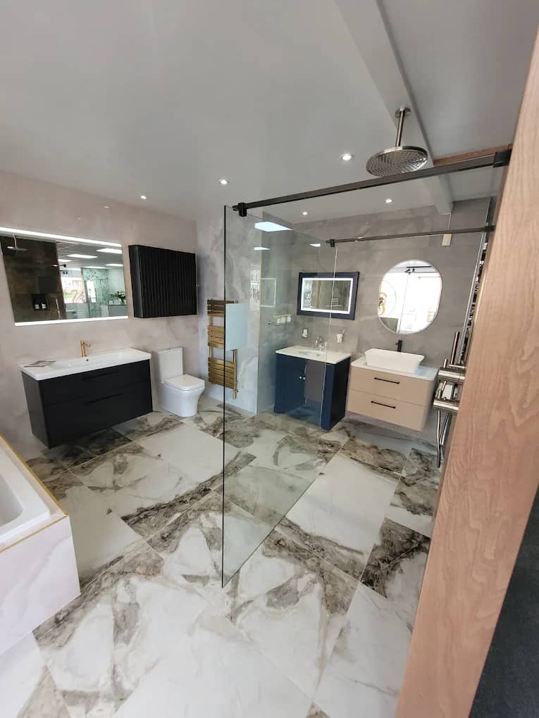 Marble-effect shower display with glass screen and navy vanity