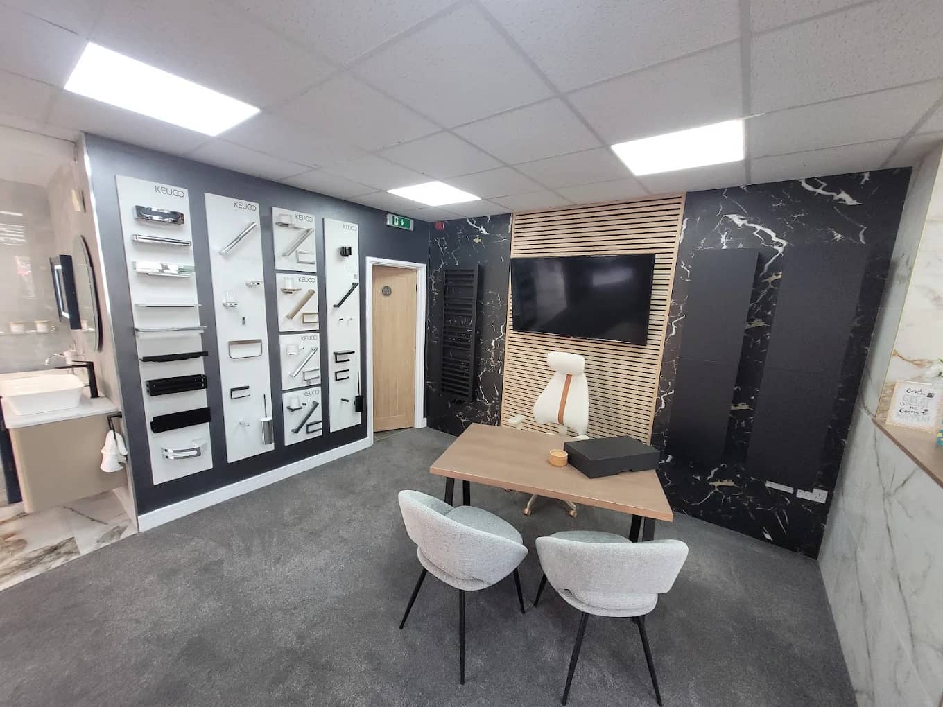 Showroom seating area with sample boards and the design consultation desk