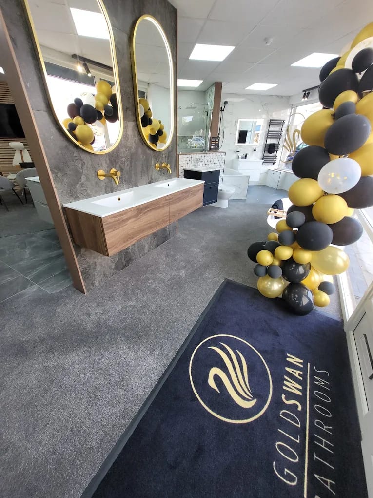 Goldswan showroom in Arnold with the swan logo rug and bathroom displays